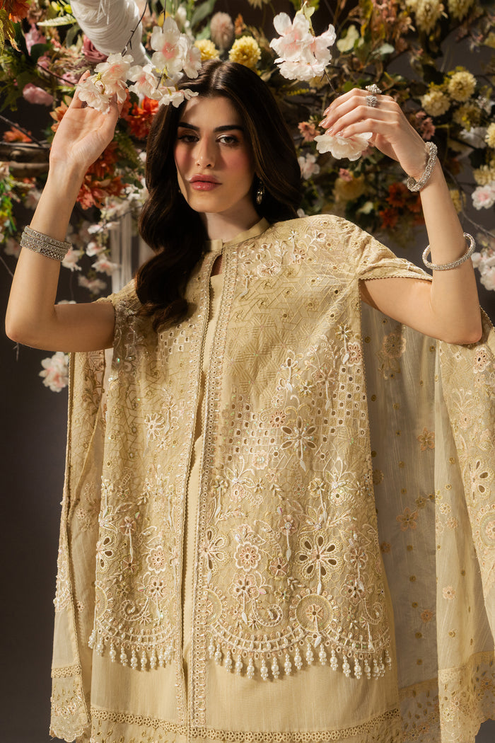 Close front view of Livia showing the pale yellow embroidered and sequined Organza cape, neckline and decorative border details.