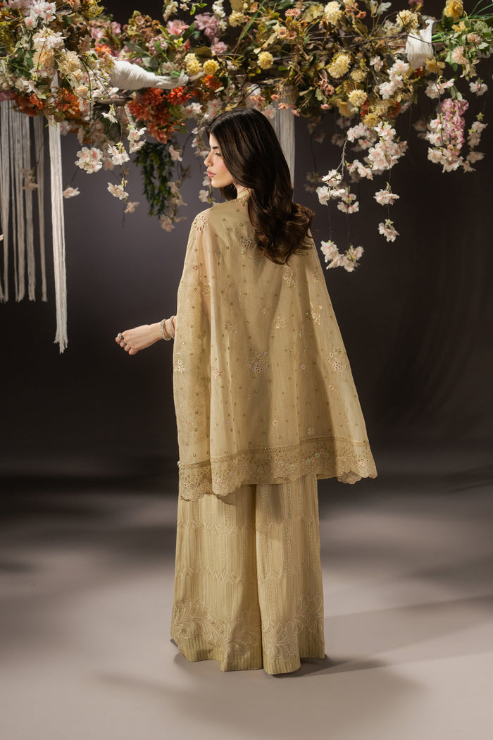 Back view of Livia pale yellow 3-piece outfit showing the flowing cape-style Organza shirt and wide PK Raw Silk pants.
