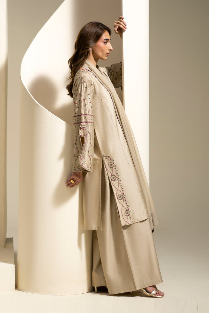 Side view of Louisa Dusty Beige casual outfit with long Cotton Sateen shirt, culotte and Crinkle dupatta.