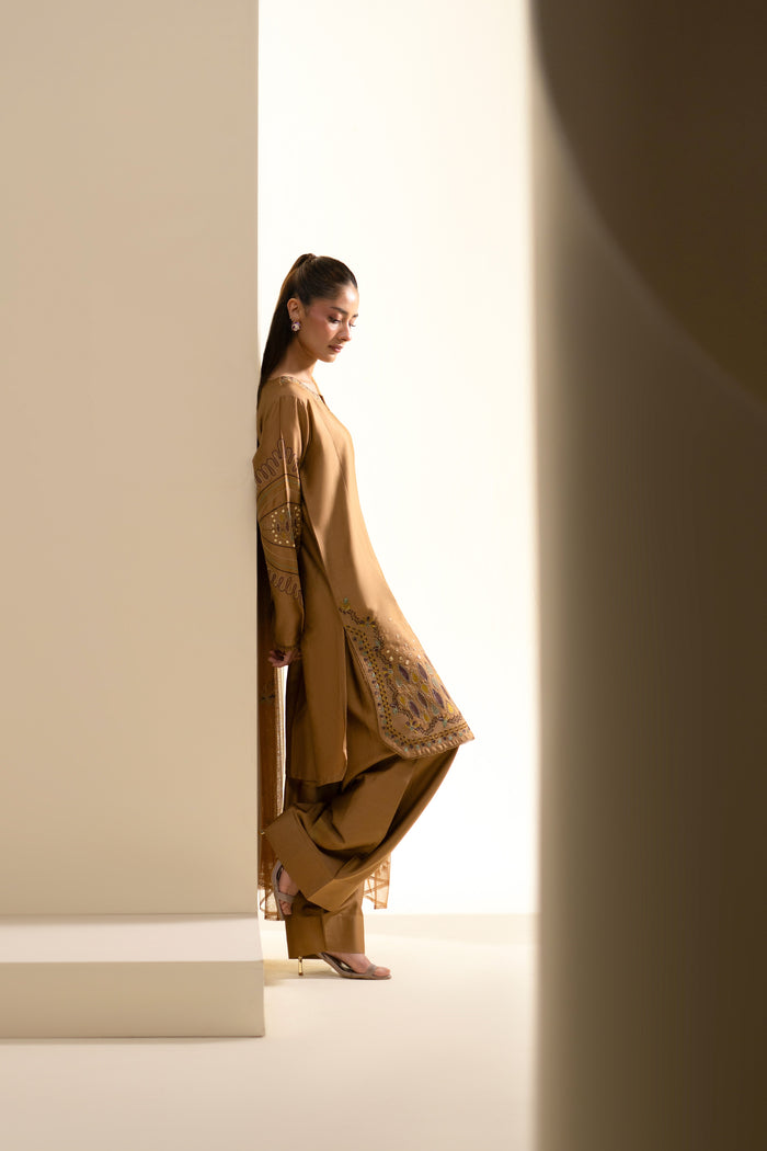 Side profile of Maddox Golden Brown 3-piece casual outfit with flowing Net dupatta.