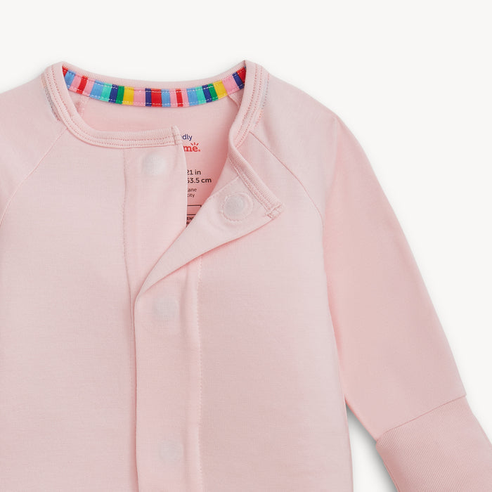 Open magnet in the center of A solid light pink long-sleeve convertible coverall romper with a hidden magnetic closure by Magnetic Me.