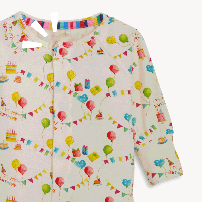 open and close movement of the magnet of A cream-colored long-sleeved convertible coverall with a watercolor "It's My Birthday" print and hidden magnetic closures that easily swap between footed and footless styles, by Magnetic Me.