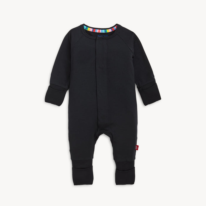 A solid black long-sleeve convertible coverall romper with a hidden magnetic closure by Magnetic Me.