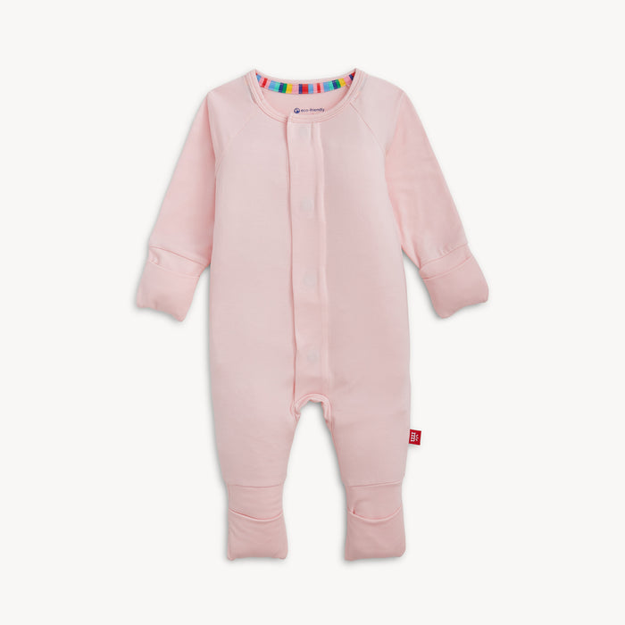 A solid light pink long-sleeve convertible coverall romper with a hidden magnetic closure by Magnetic Me.