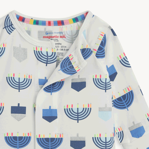 Open and close magnet in the front center of Baby footie with a blue Menorah pattern, by Magnetic Me