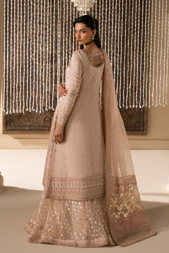Side view of Mahbeer pale pink Nikkah dress showing smooth shirt fall, flared sharara and soft organza dupatta drape, elegant ready made bridal formal outfit.