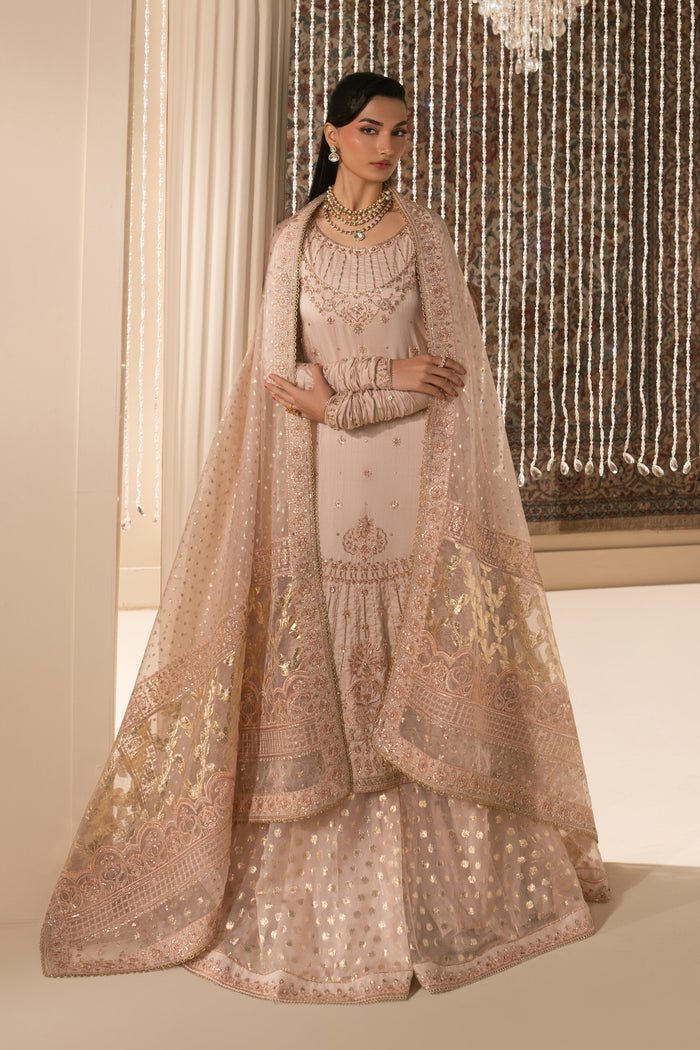 Full standing pose of Mahbeer formal Nikkah outfit featuring balanced silhouette, layered sharara flare and light dupatta styling, modest ready to wear wedding attire.