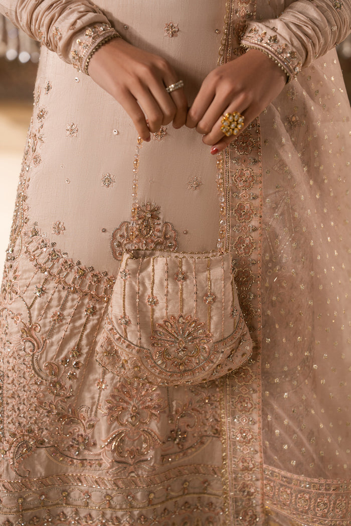 Close up detail of Mahbeer embroidery and matching pouch in pale pink tone, neat stitching formal Nikkah wear for women.