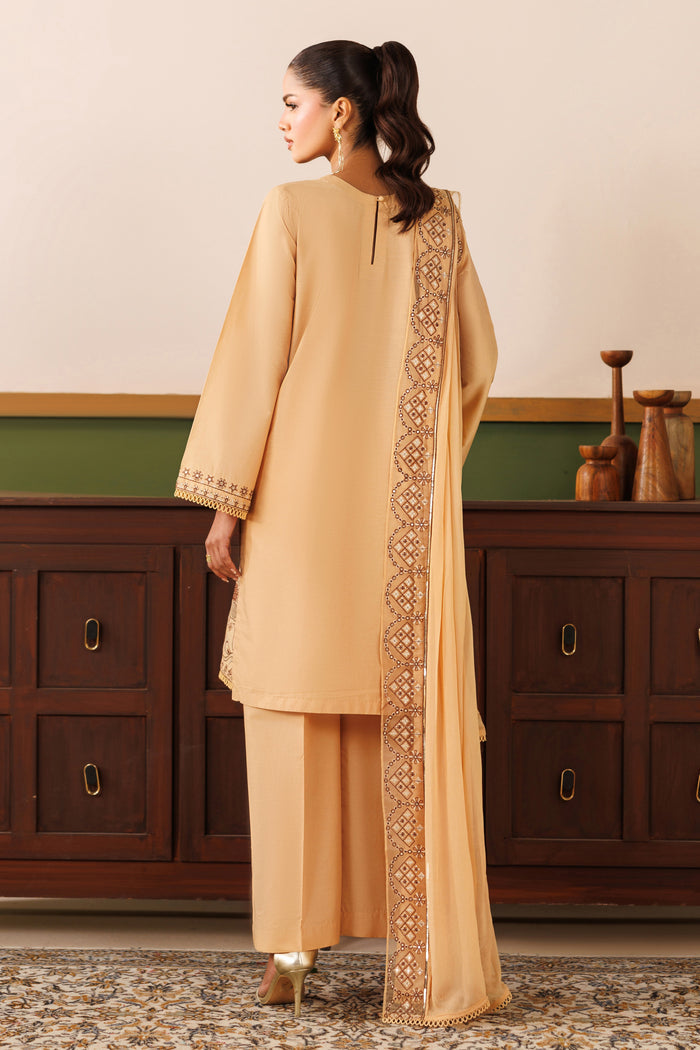 Back view of NAQSHI Melia outfit showing straight cambric shirt fall, loose sleeves, and relaxed culotte trousers