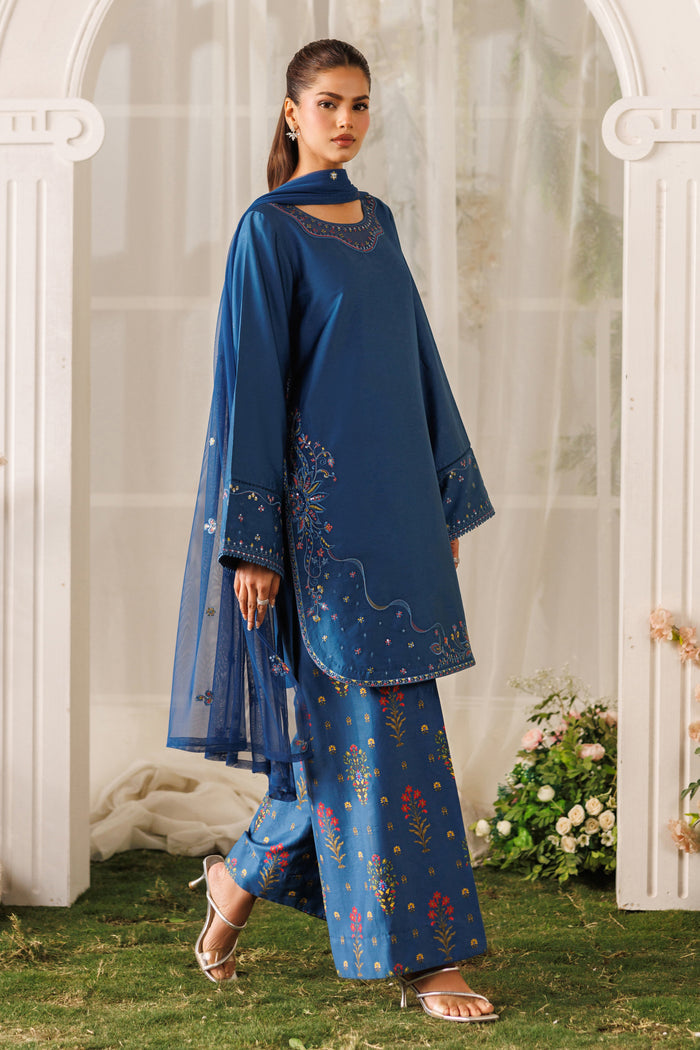 Side standing view of NAQSHI Mihha outfit highlighting printed culotte trousers and smooth cotton satin fabric