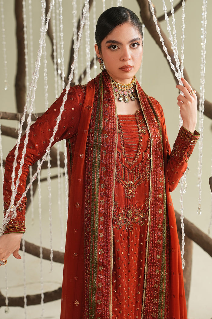 Rust orange formal ready-to-wear outfit with long shirt, culotte, and dupatta, side pose showing elegant styling and full design