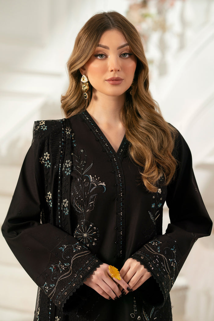 Close‑up of NAQSHI Moheeni beaded and embroidered neck pati on black cambric shirt highlighting fine threadwork and beads