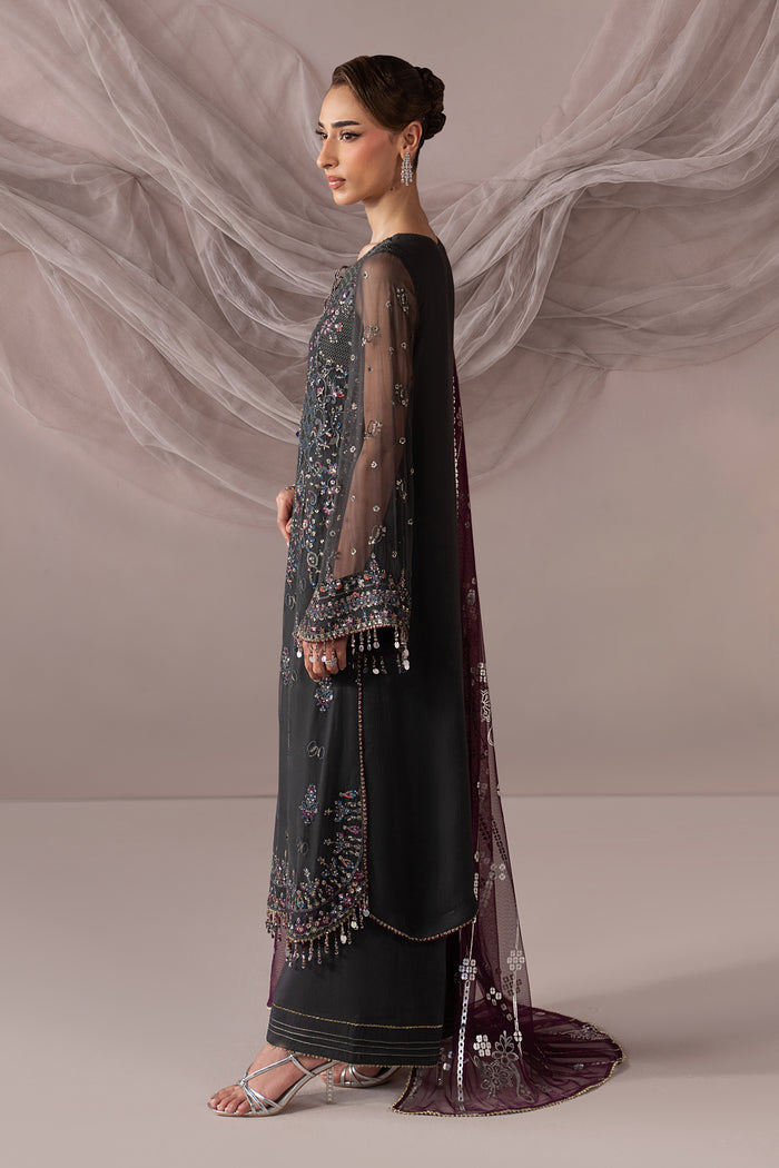 Side view of Moriah showing the dark grey embroidered Crinkle shirt, bell sleeves, culotte trouser and draped Net dupatta.