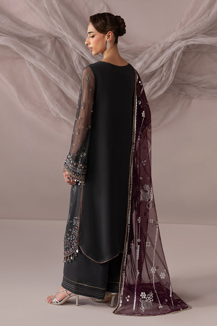 Back view of Moriah highlighting the long dark grey shirt and flowing deep plum Net dupatta with printed detailing.