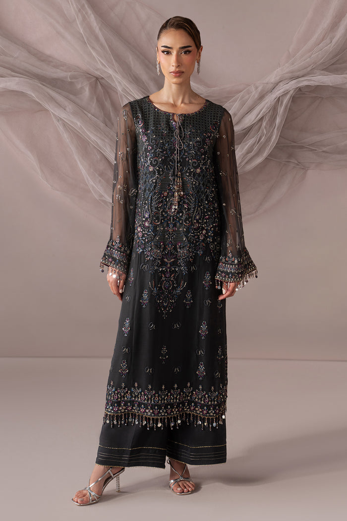 Full front view of Moriah showing the dark grey embroidered shirt, round hem and coordinated PK Raw Silk culotte.