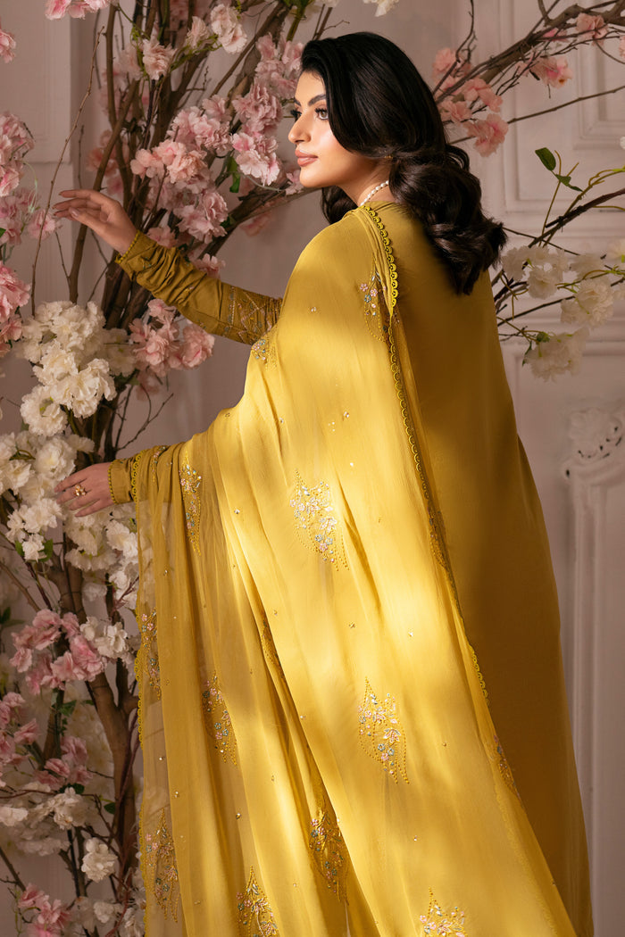 Side view of NAQSHI Nageena showing fitted cambric sleeve with embroidered cuff and subtle lace detailing.