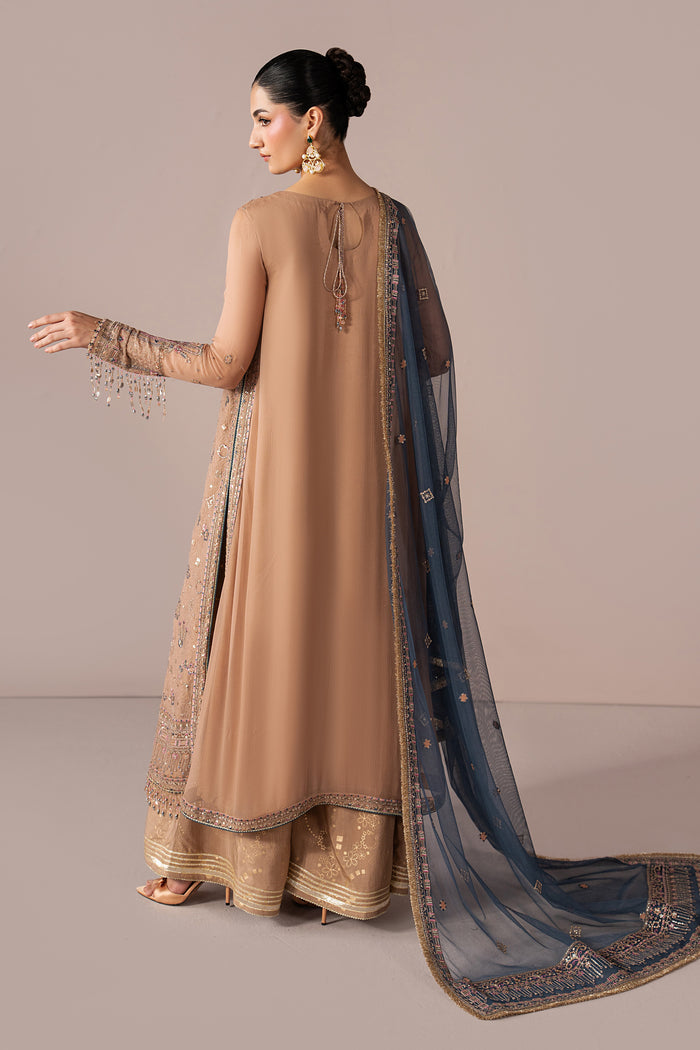 Back view of Navira highlighting the peach shirt, draped contrast Net dupatta and soft semi-formal fall.
