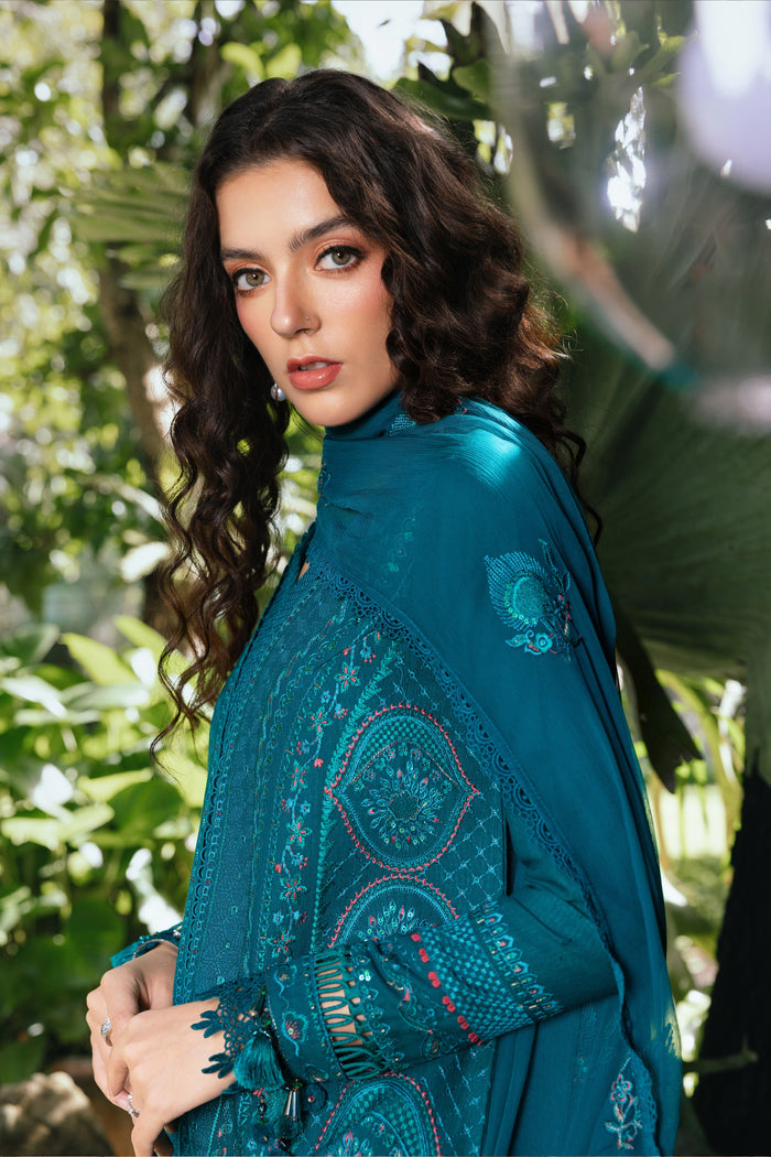 Slight angle pose showing NAQSHI Noor Bano bottle green khaddar shirt with detailed beadwork and embroidered motif spread — festive casual pret set