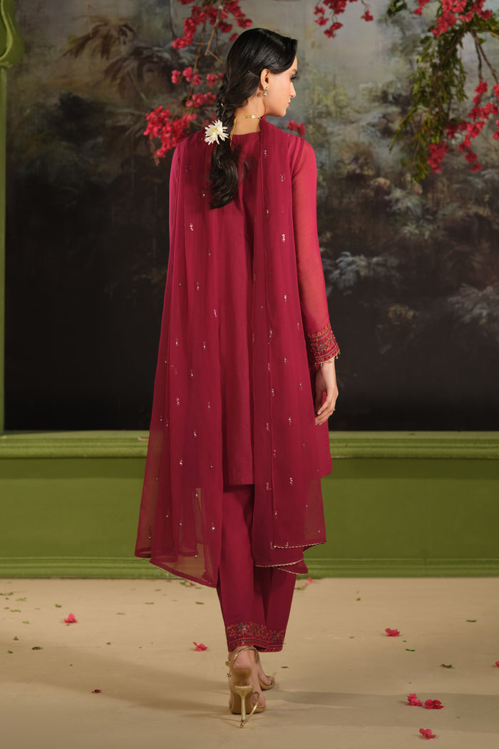 back view of NAQSHI Parwaaz maroon embroidered Pima lawn shirt paired with cambric culotte trousers and flowing crinkle dupatta