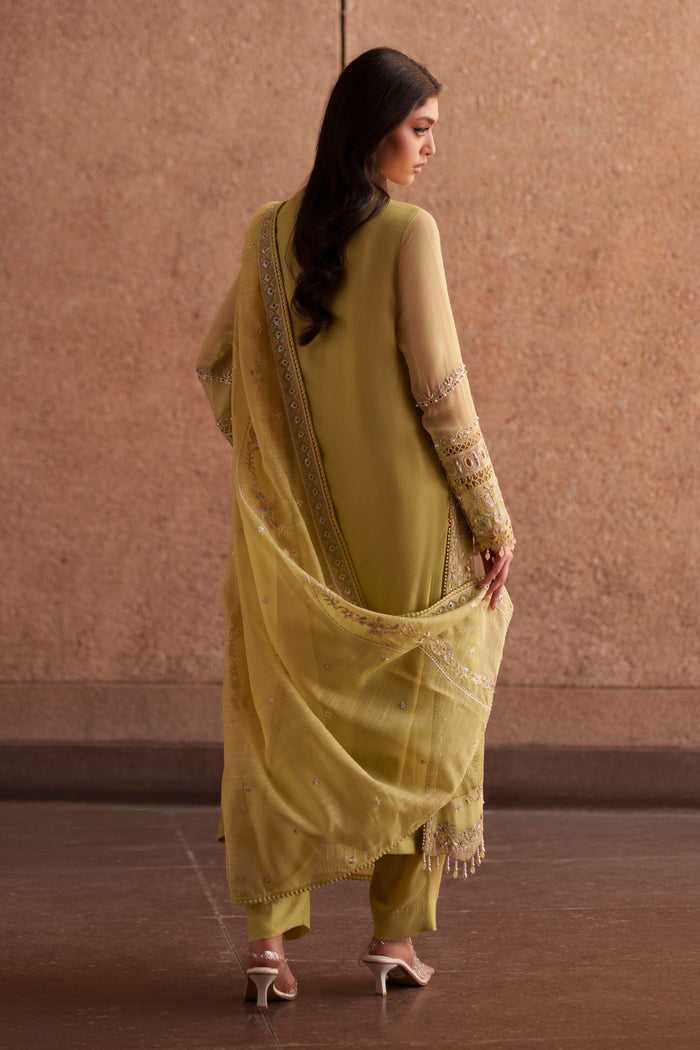 Side profile of NAQSHI Pedro lime green luxury pret outfit showcasing flowing open gown silhouette and embroidered cotton organza dupatta