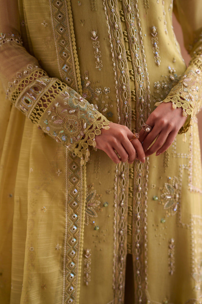Close-up of Pedro lime green embroidered khadi net shirt highlighting intricate embroidery, lace finishing, pintuck details and decorative borders