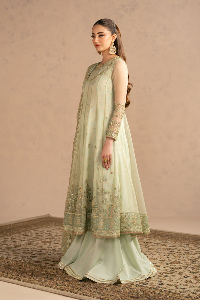 Full view displaying traditional sharara flare paired with long frock and light dupatta styling, semi formal gathering outfit.