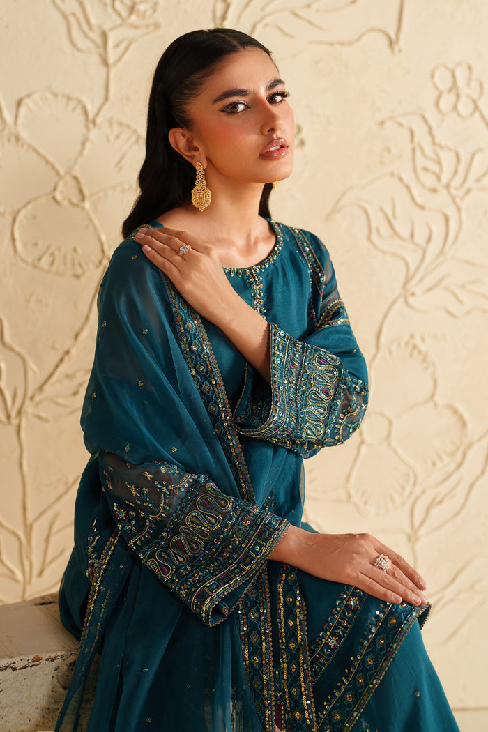 Upper body view of NAQSHI deep teal dress with embroidered sleeves and refined festive styling