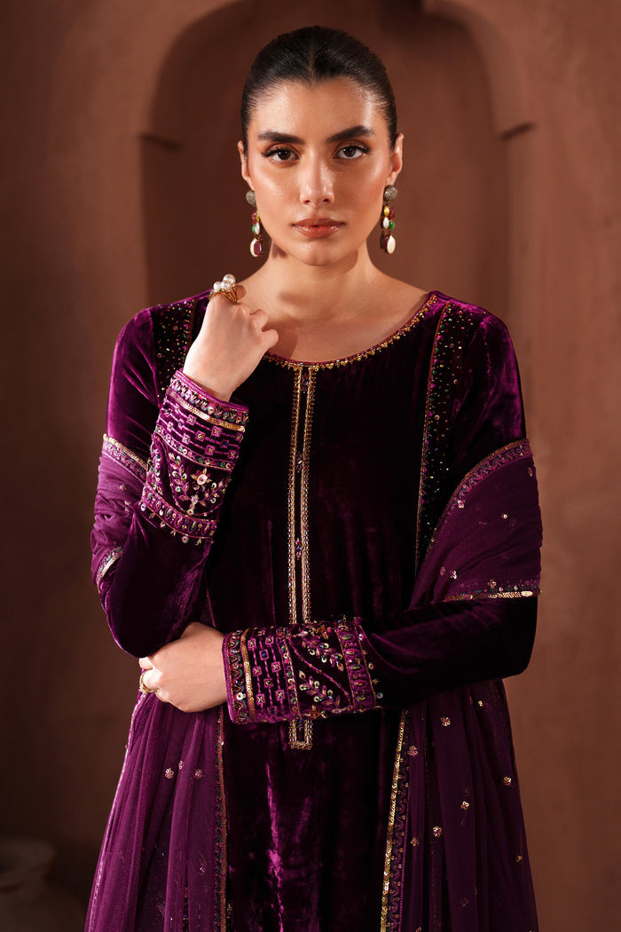 Upper body view of NAQSHI formal velvet dress showing embroidered neckline, long sleeves, and refined party wear styling
