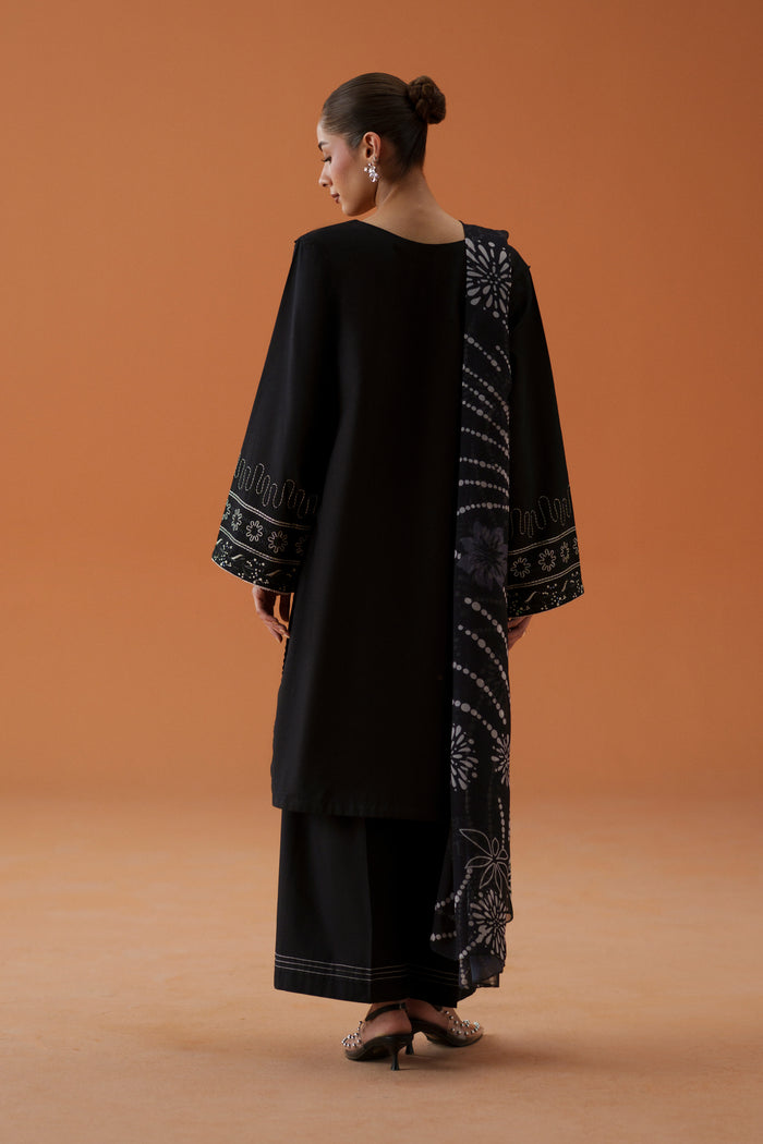 Back view of Riedel black 3-piece outfit with long embroidered lawn shirt and printed crinkle chiffon dupatta for a polished festive look.