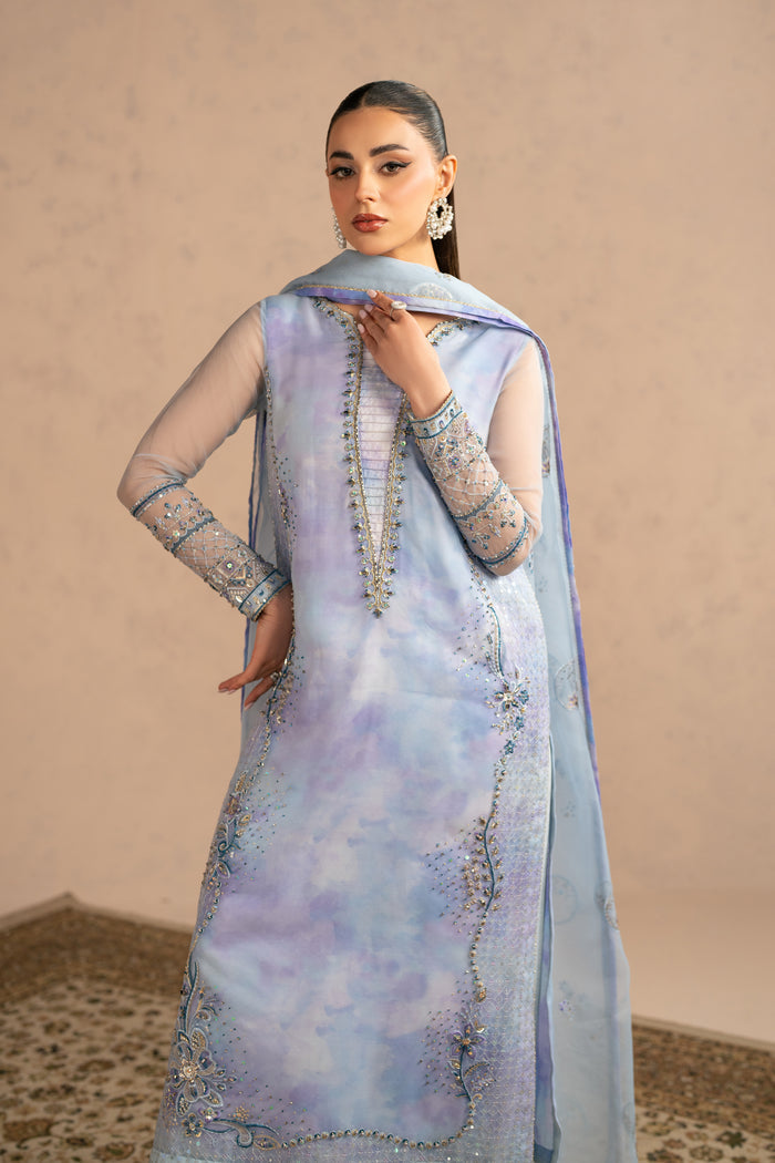 Angled pose showing embroidered neckline and panel detailing with airy dupatta drape, stitched luxury pret event wear.