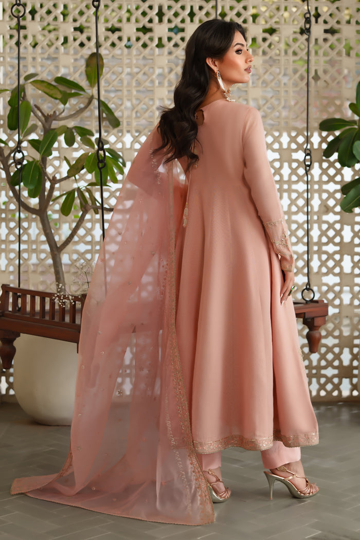 Back view of NAQSHI Safron frock highlighting paneled design, embroidery and sequin border