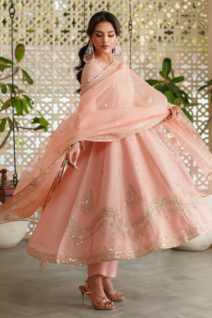 Close‑up of NAQSHI Safron frock neckline showcasing intricate embroidery and shimmering sequin details