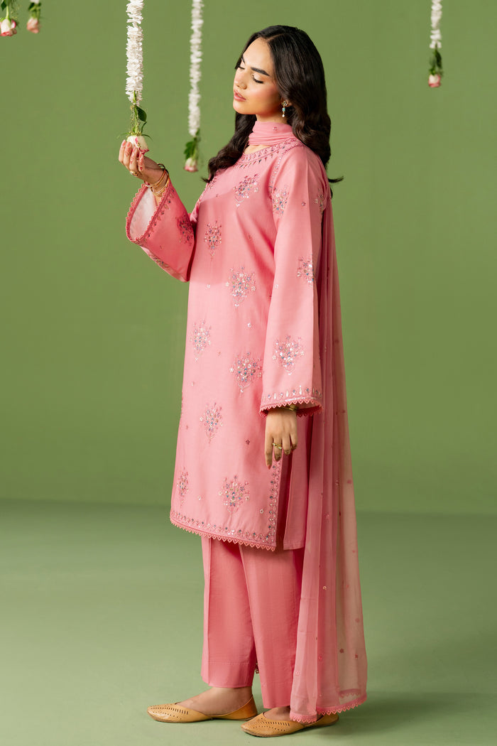 Side standing view of NAQSHI Saima outfit highlighting clean shirt cut, loose sleeves, and relaxed summer styling