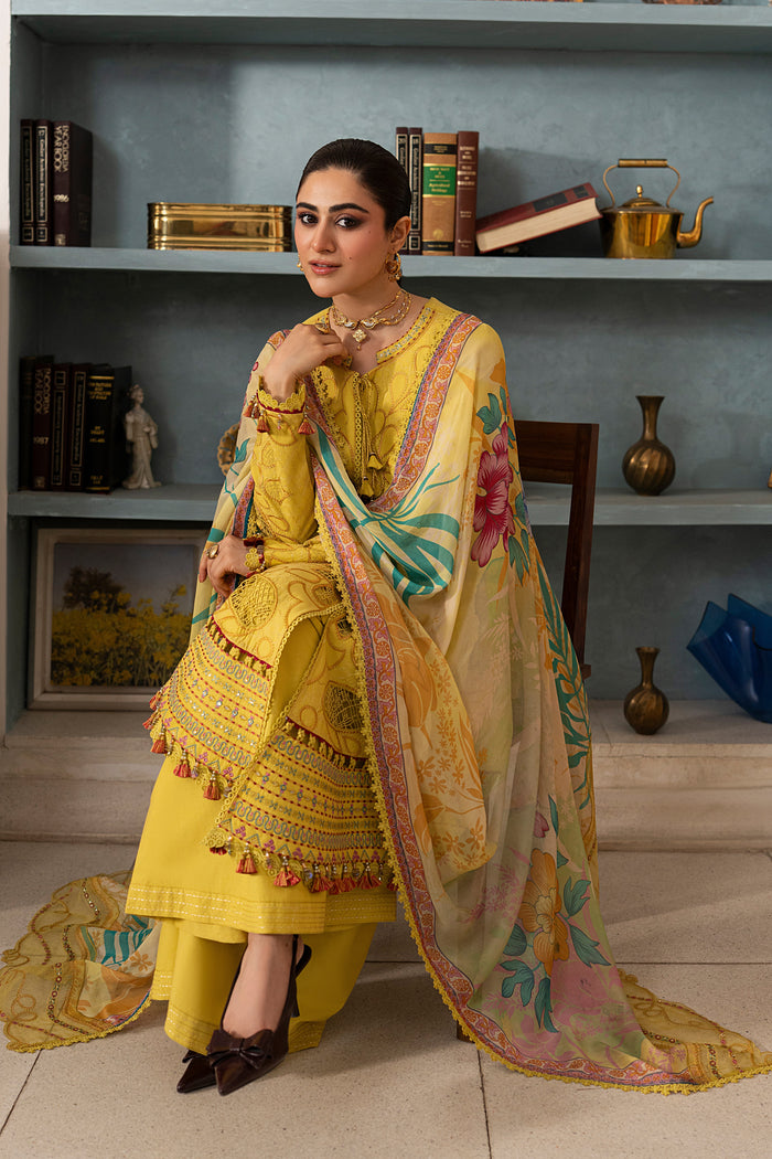 Seated styling shot of NAQSHI Seraya lemon casual pret outfit showcasing embroidered shirt details, wide culotte trousers and colorful floral dupatta