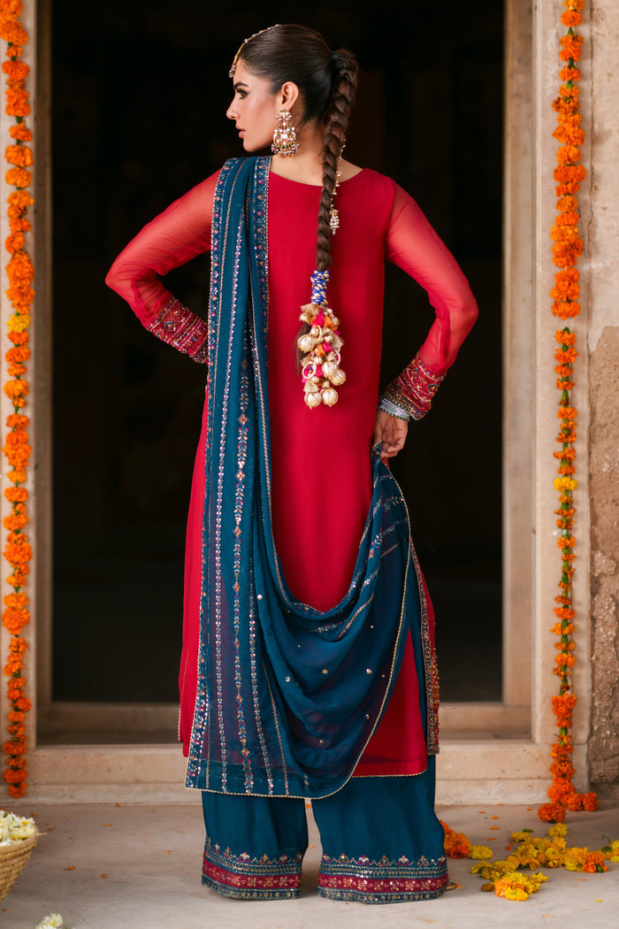Three piece shocking pink crinkle chiffon suit with embellished long shirt, zinc dupatta and embroidered culotte trousers for festive occasions
