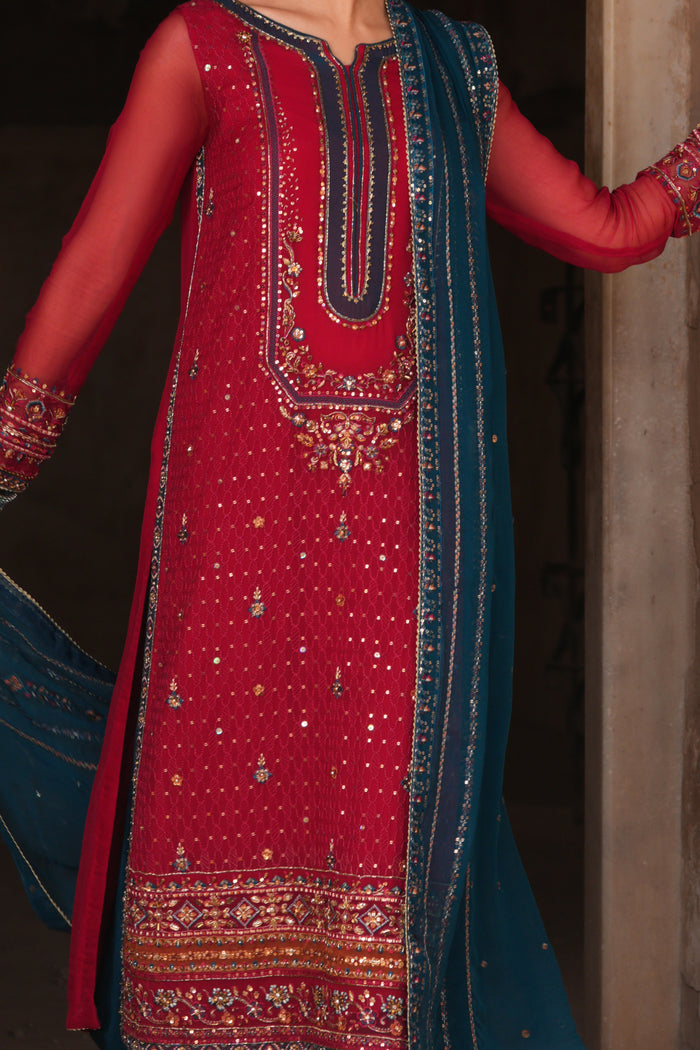Boat neckline with adda work, sequins embellishment and zinc contrast piping on Shazim crinkle chiffon semi formal shirt