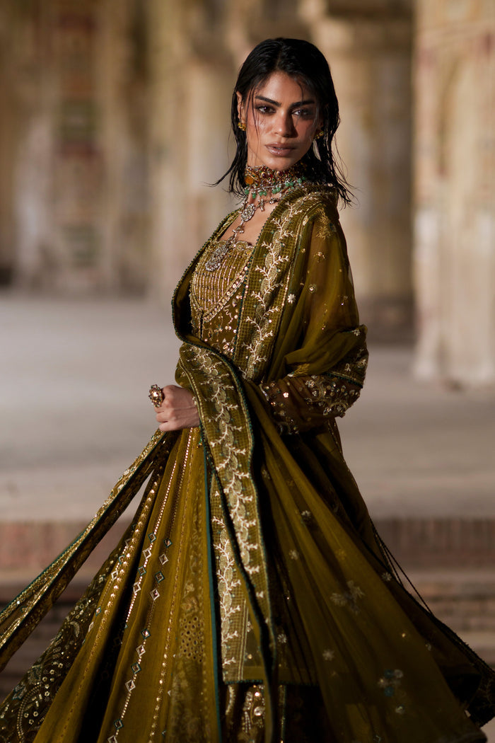 Sillage olive green evening gown front view with wide flare and embroidered geometric lower panels.