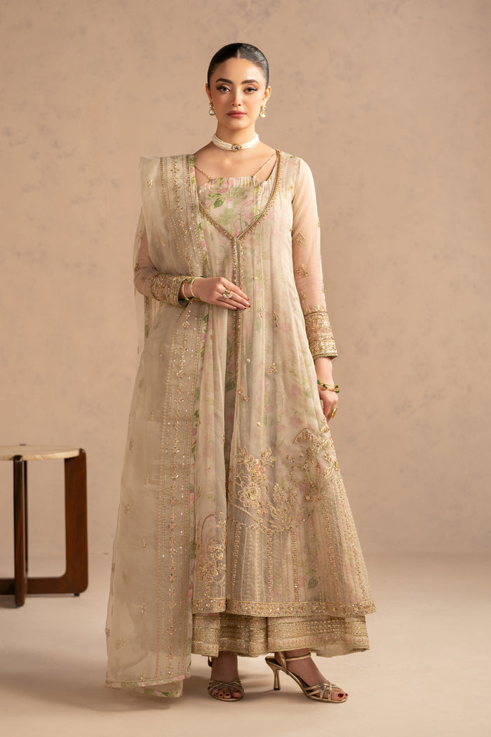 Full standing front look displaying center slit detail with adda work and balanced silhouette, suitable for engagement and family functions.