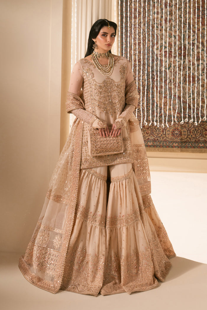 Soft peach bridal Nikkah dress Tizmat by NAQSHI, full front view showing organza embroidered shirt, flared garara, sheer dupatta and matching pouch, ready to wear 4-piece formal wedding outfit.