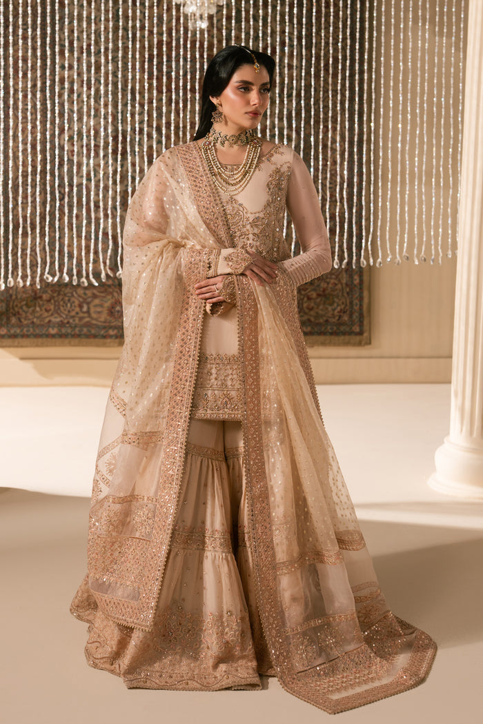 Full standing look of peach Tizmat formal Nikkah dress featuring layered organza garara flare, embroidered shirt and light dupatta, complete ready made wedding outfit for intimate ceremony.
