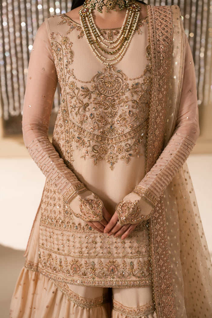 Detailed upper body view of Tizmat peach organza shirt embroidery and neckline design with clean stitching, modest formal bridal wear for Nikkah ceremony.
