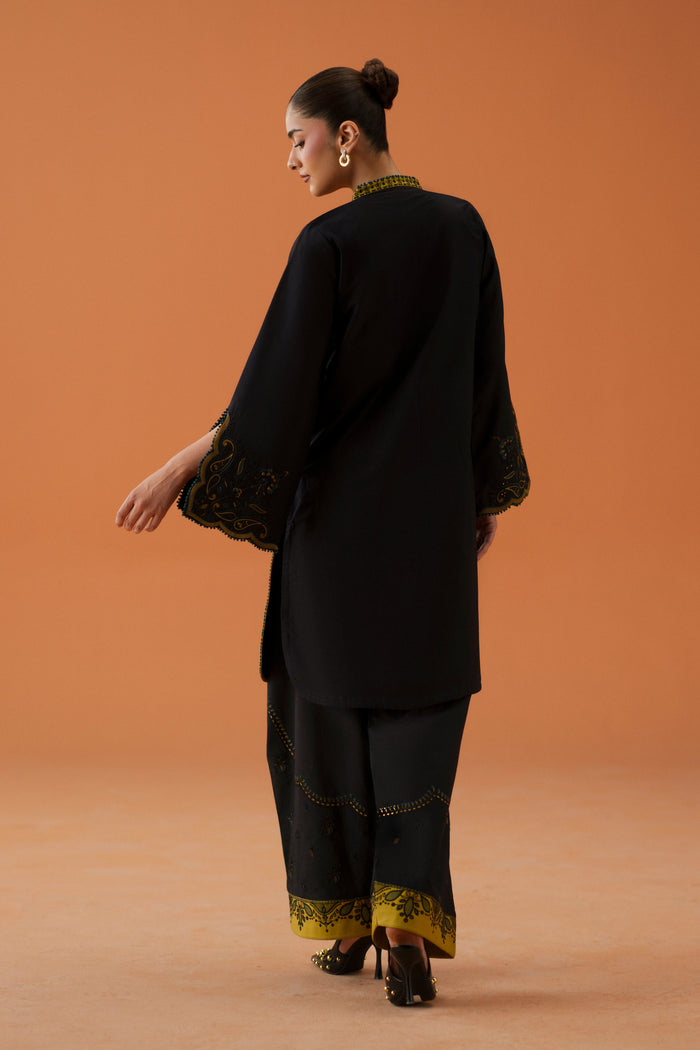 Back view of Vera black ready-to-wear outfit with long lawn shirt, printed crinkle chiffon dupatta, and embroidered shalwar.