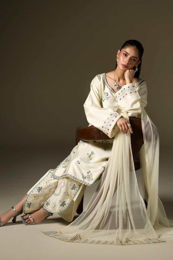 Willow Cream White casual outfit seated with embroidered shirt, culotte and flowing Net dupatta.