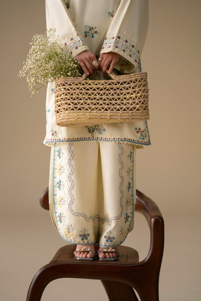 Willow Cream White outfit detail showing embroidered Cotton Sateen culotte and floral shirt sleeves.