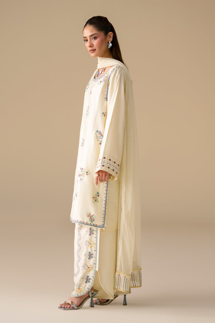 Side view of Willow Cream White Cotton Sateen shirt and embroidered culotte with Net dupatta.