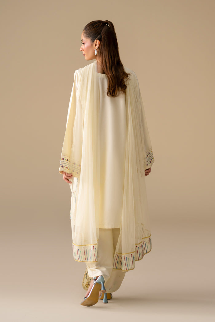 Back view of Willow Cream White 3-piece casual outfit with long shirt and embroidered Net dupatta.