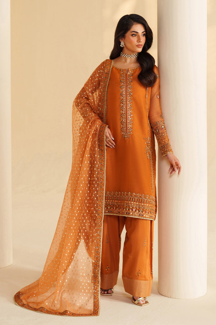 NAQSHI burnt orange ready-to-wear formal dress with fine embroidery and sheer dupatta, styled for festive and party events