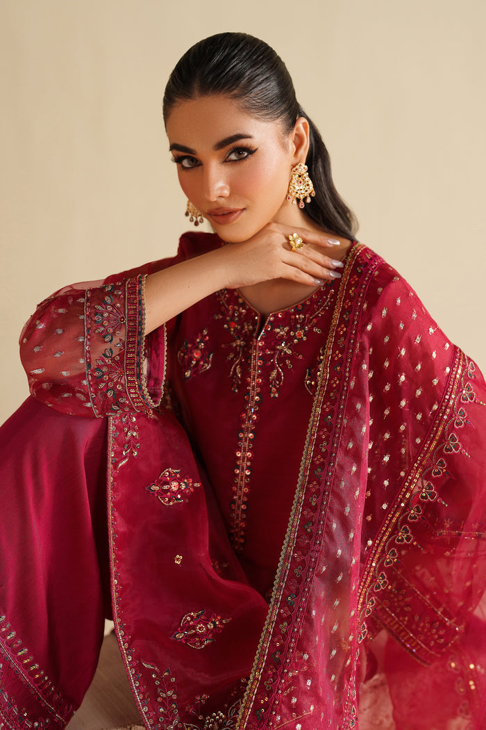 Upper body view of NAQSHI deep red ready-to-wear formal outfit with embroidered neckline and refined party wear styling