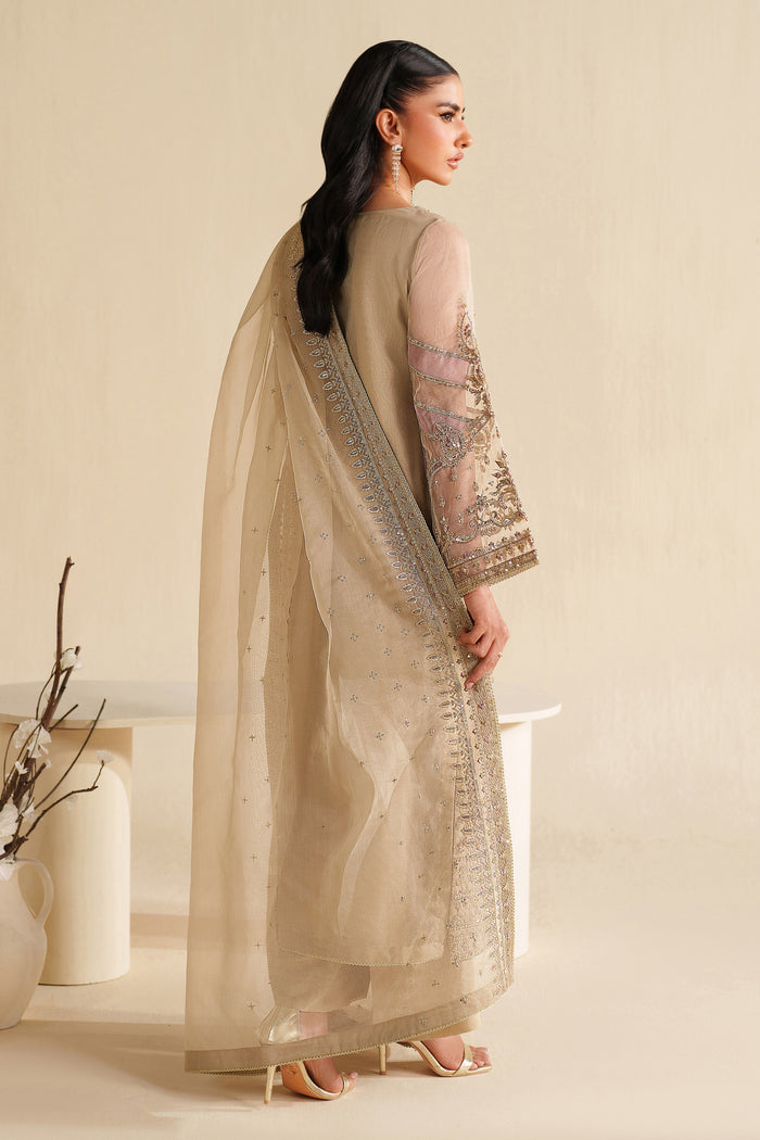 Side view of NAQSHI ivory beige formal ready-to-wear outfit showing straight cut, light embroidery, and polished event finish
