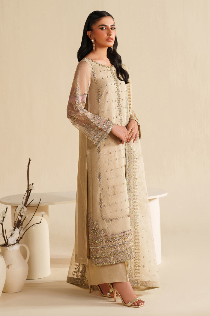 Side view of NAQSHI ivory beige formal ready-to-wear outfit showing straight cut, light embroidery, and polished event finish